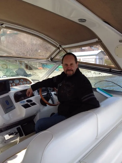 Barry Lepp at the helm of a cruiser